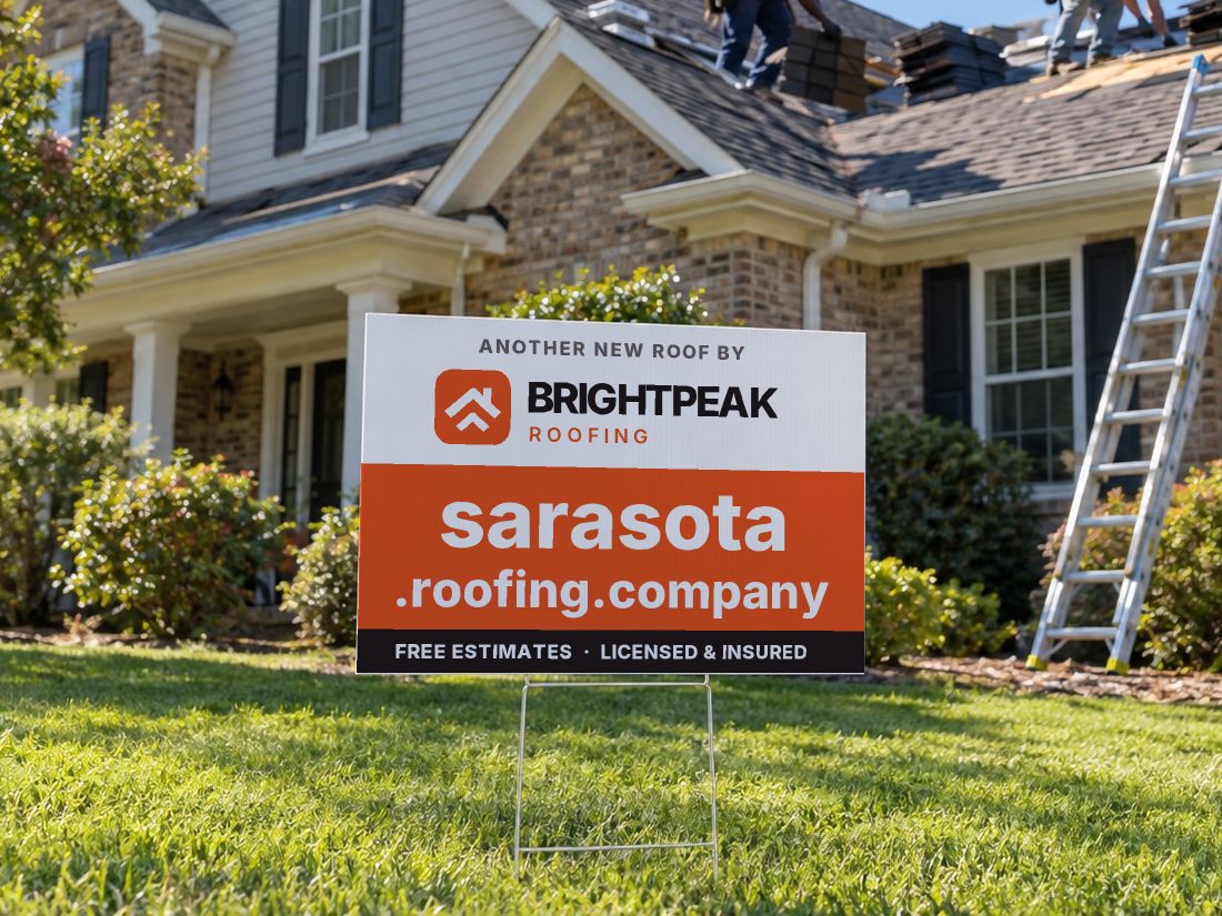 sarasota.roofing.company on a yard sign in front of a house getting a new roof